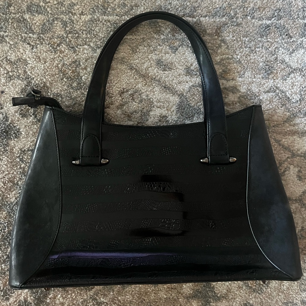Black leather bag with printed design